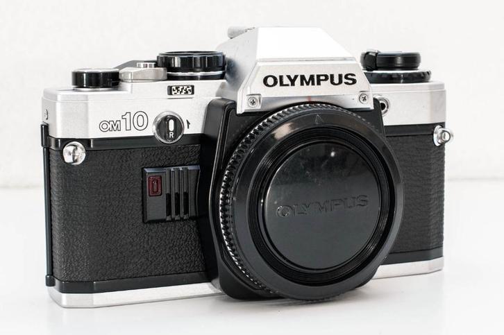 Olympus OM10 body 35mm film SLR + nieuwe batterijen, Audio, Tv en Foto, Fotocamera's Analoog, Refurbished, Spiegelreflex, Olympus