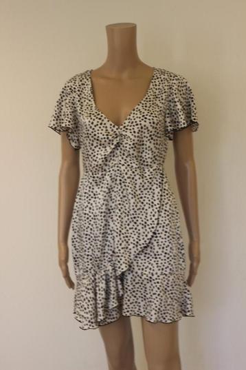 Roomwit/zwart gestipt jurkje maat S beschikbaar voor biedingen