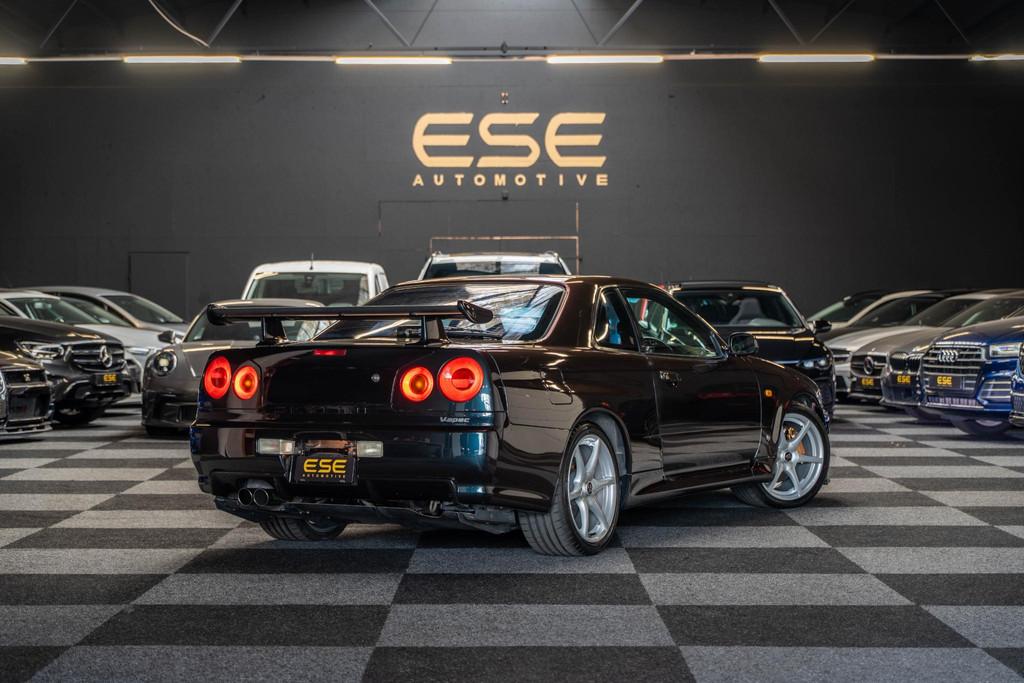 Nissan Skyline R34 GTR V-spec Midnight Purple II, Auto's, Nissan, Stof, Gebruikt, Zwart, Overige kleuren