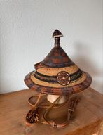 Afrikaanse hoed van leer en riet, Ophalen