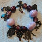 Bronskleurige armband met bedels en glazen kralen., Ophalen of Verzenden