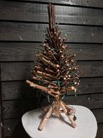 Kerstboom van takken, Ophalen