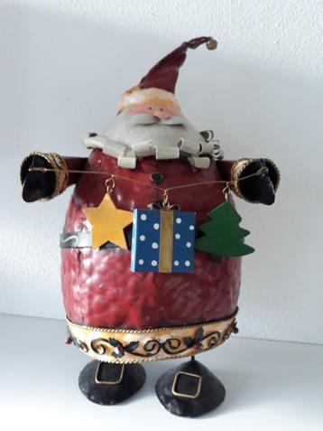 Oude blikken kerstman beschikbaar voor biedingen