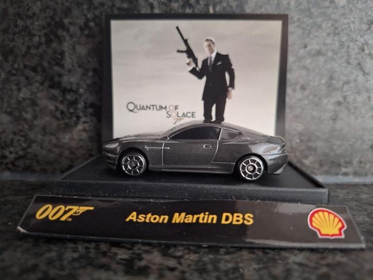 NIEUW 1:64 Aston Martin DBS "James Bond 007" Shell, Hobby en Vrije tijd, Modelauto's | Overige schalen, Nieuw, Auto, Ophalen of Verzenden