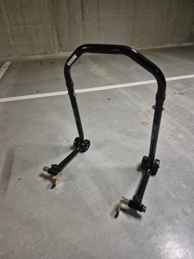 Paddock stand nieuw, Ophalen
