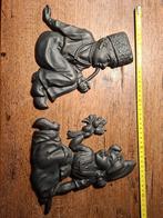 Twee ijzeren beeldjes van kinderen, Ophalen