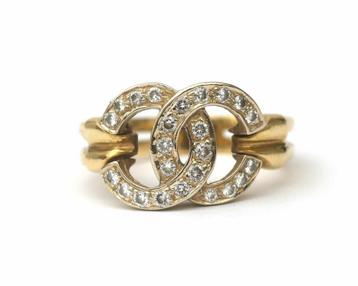 Een 14 krt. bicolor gouden ring bezet met diamant beschikbaar voor biedingen