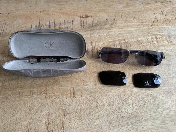 Calvin Klein Zonnebril in koker, Sieraden, Tassen en Uiterlijk, Zonnebrillen en Brillen | Heren, Nieuw, Zonnebril op sterkte, Overige merken