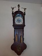 Antieke klok met figuren, Ophalen