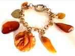 Antieke barnsteen en bakeliet bedel armband, Ophalen of Verzenden, Overige materialen, Armband, Verguld