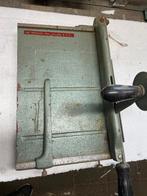 papiersnijder, Ophalen