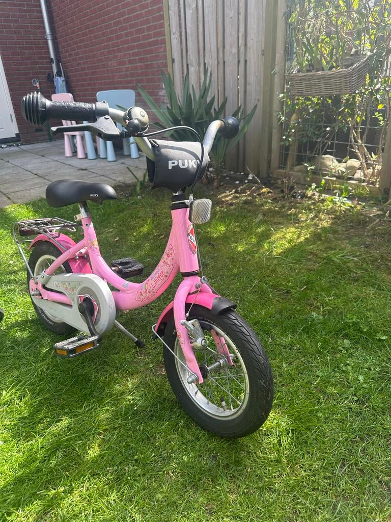Roze Puky kinderfiets met zijwieltjes, Fietsen en Brommers, Fietsen | Kinderfietsjes, Ophalen, Terugtraprem, Zijwieltjes, 16 tot 20 inch