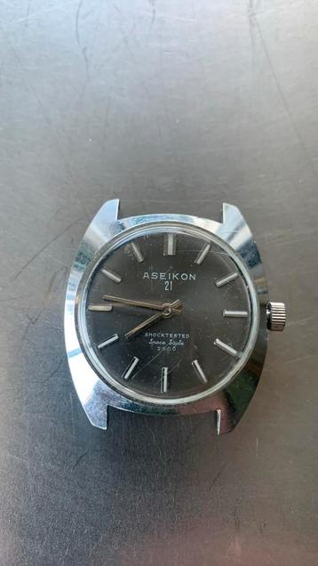 Aseikon mechanisch horloge werkend zonder bandje beschikbaar voor biedingen