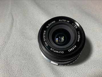 Super mooie OLYMPUS OM G.ZUIKOAUTO-W 1:3.5-28mm lens beschikbaar voor biedingen