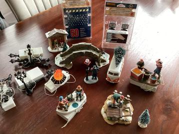 Diverse figuren met verlichting voor kerstdorp beschikbaar voor biedingen