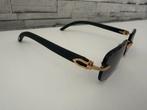 Cartier Zonnebril met Gouden Details en Zwart Montuur, Overige merken, Zonnebril, Zwart, Ophalen of Verzenden