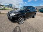 Hyundai Tucson 2.7i 4WD Champion Automaat/Dealer onderhouden, Auto's, 2656 cc, Zwart, Stoelverwarming, Euro 4