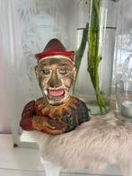 Gietijzeren antieke spaarpot uit Engeland, Ophalen