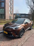 Toyota C-HR 1.8 Hybrid 122pk CVT 2018 Bruin 31.000 km! JBL, Auto's, 725 kg, 4 cilinders, Bruin, Leder en Stof