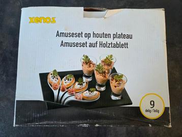 Amuseset 9 delig op houten plateau + 4 extra bakjes beschikbaar voor biedingen