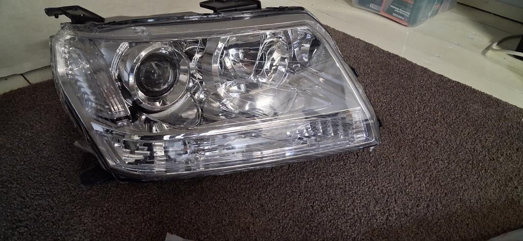 Koplamp links Suzuki Grand Vitara 2.4 2010, Auto-onderdelen, Ophalen of Verzenden, Nieuw, Suzuki
