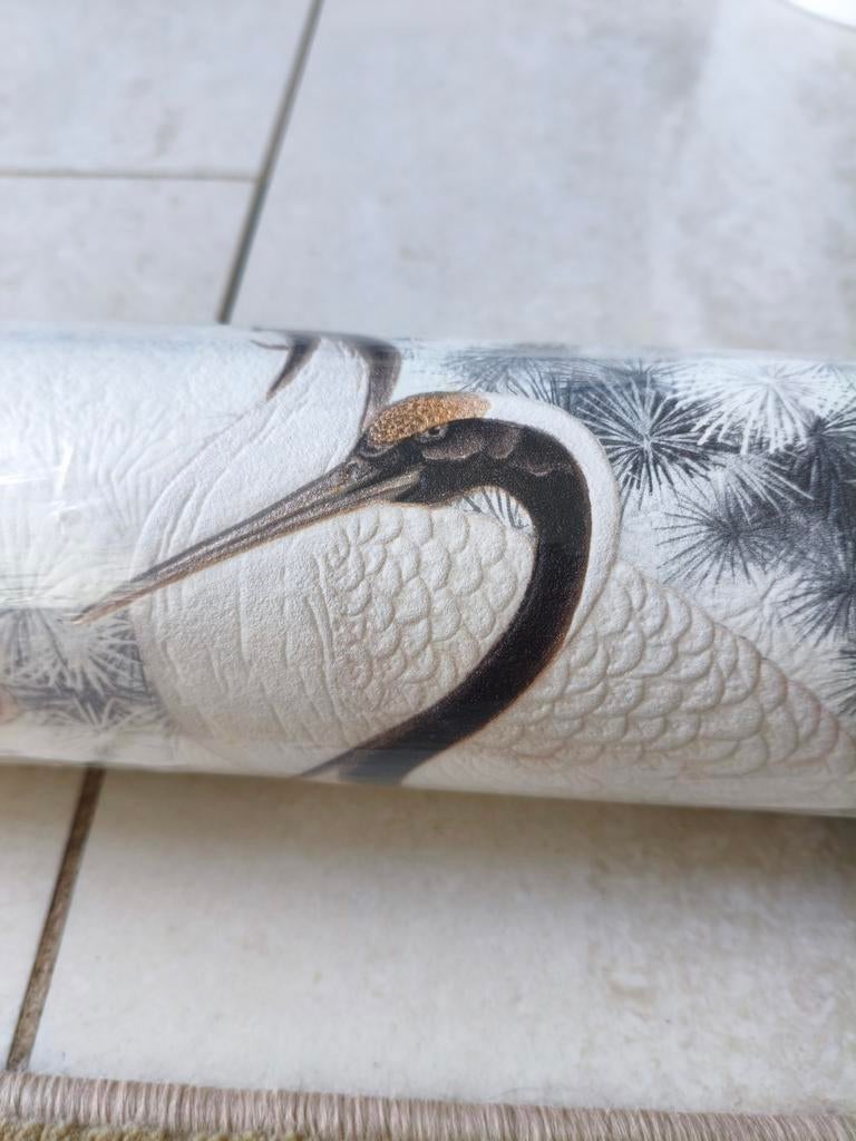 Nieuwe rol vliesbehang met vogelprint, Ophalen