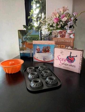 Bakspullen en -boeken en een cocktailboek beschikbaar voor biedingen