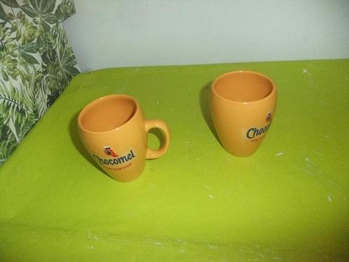 2 CHOCOMEL BEKERS SAMEN €0,95!, Huis en Inrichting, Keuken | Servies, Gebruikt, Kop(pen) en/of Schotel(s), Overige stijlen, Ophalen