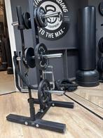 Gebruikte zwarte schijven 50 mm en barbell/halter standaard, Sport en Fitness, Fitnessmaterialen, Gebruikt, Ophalen of Verzenden