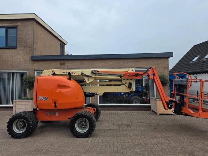 JLG 450aj knikarm hoogwerker ruwterein (bj 2006), Zakelijke goederen, Machines en Bouw | Liften, Steigers en Ladders