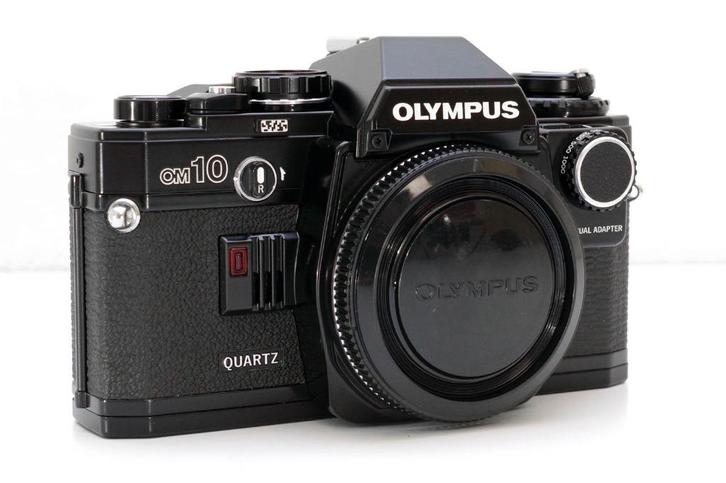 Olympus OM10 Quartz body 35mm film SLR + nieuwe batterijen, Audio, Tv en Foto, Fotocamera's Analoog, Refurbished, Spiegelreflex