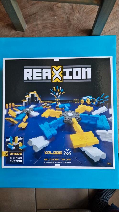 Reaxion bouwstenen domino, Kinderen en Baby's, Speelgoed | Bouwstenen, Zo goed als nieuw, Overige merken, Ophalen of Verzenden