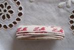 Antiek monogramband - letterband met de letters L M, Hobby en Vrije tijd, Naaien en Fournituren, Ophalen of Verzenden, Nieuw, Lint, Band of Elastiek