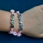Twee matching armbanden roze, Kunststof of Plastic, Ophalen of Verzenden, Zo goed als nieuw, Roze