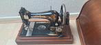 Singer antieke naaimachine, Ophalen