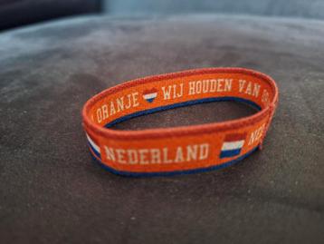 Oranje Armband met Tekst Holland en Nederlandse Vlag
 beschikbaar voor biedingen