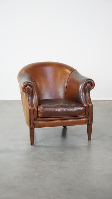 Stoere maar comfortabele vintage clubfauteuil beschikbaar voor biedingen