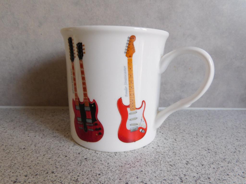 Mok 9x8,5 cm. Guitars the Leonardo Collection, Huis en Inrichting, Ophalen of Verzenden, Zo goed als nieuw, Overige stijlen, Kop(pen) en/of Schotel(s)