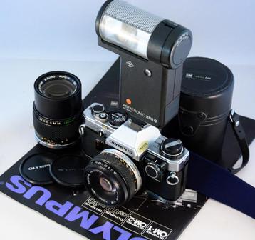 Olympus OM10 met 50mm/1.8, 135mm/3.5, flitser en paraattas beschikbaar voor biedingen