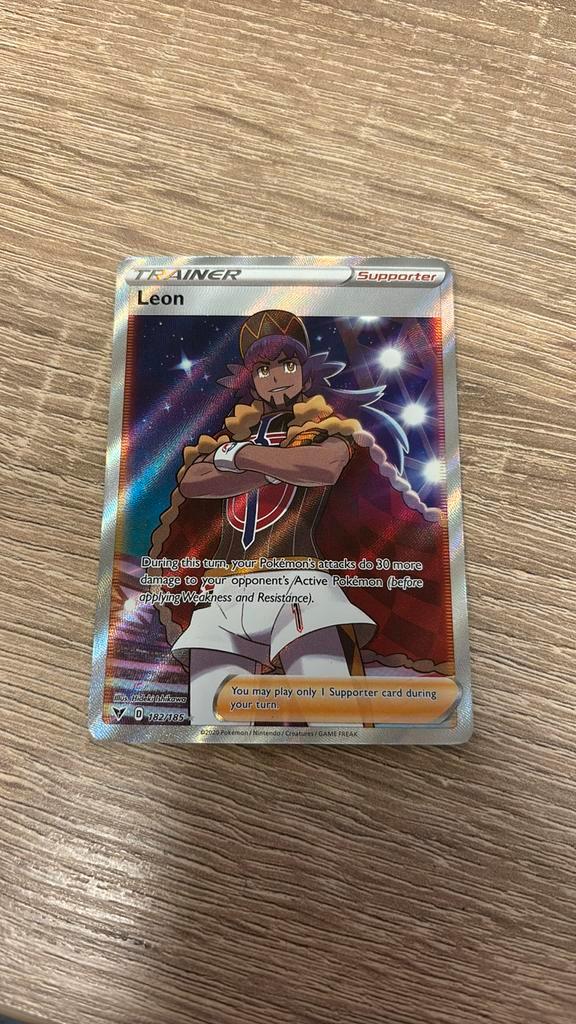 Trainer Leon 182/185 - Vivid Voltage, Hobby en Vrije tijd, Verzamelkaartspellen | Overige, Zo goed als nieuw, Ophalen of Verzenden