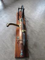 Antieke koperen waterpomp, Ophalen