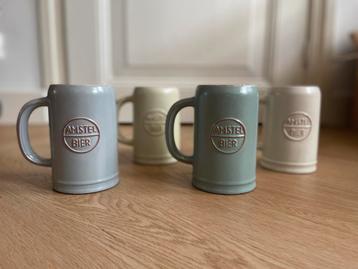 4 aardewerken bierpullen Amstel. Leuk sinterklaascadeau beschikbaar voor biedingen
