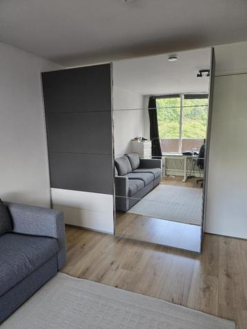 Moderne kledingkast Rauch Orlando – Grijs/wit met spiegel beschikbaar voor biedingen