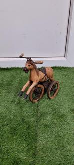 Antieke houten paard driewieler, Ophalen