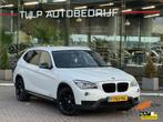 BMW X1 sDrive20i High Executive Automaat 2014 Leder stof Nav, Euro 6, 4 cilinders, Leder en Stof, Wit
