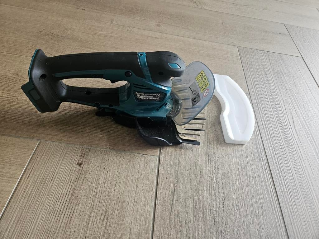 Makita DUM604 Accu Graskantenschaar - Zo goed als nieuw, Ophalen of Verzenden, Zo goed als nieuw, Accu