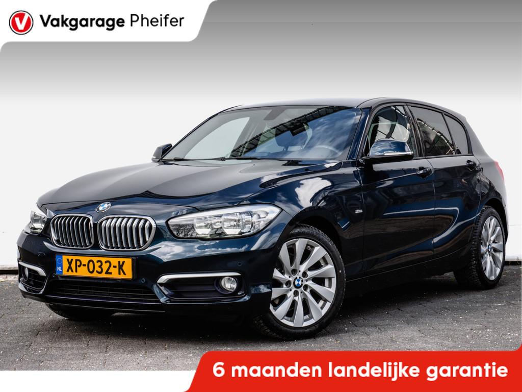 BMW 1-serie 118i 136pk Aut.8 Urban Lederen int/ Stoelverwarm, Auto's, BMW, Gebruikt, Met garantie (alle), Blauw, Leder