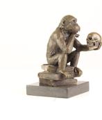 Bronzen beeld de denker aapje, Ophalen