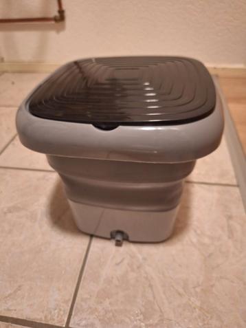 Opvouwbare slow wasser met afvoerslang en adapter. beschikbaar voor biedingen