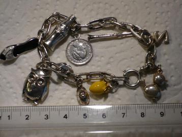 Prachtige zilveren bedel armband met ten zilveren bedels beschikbaar voor biedingen